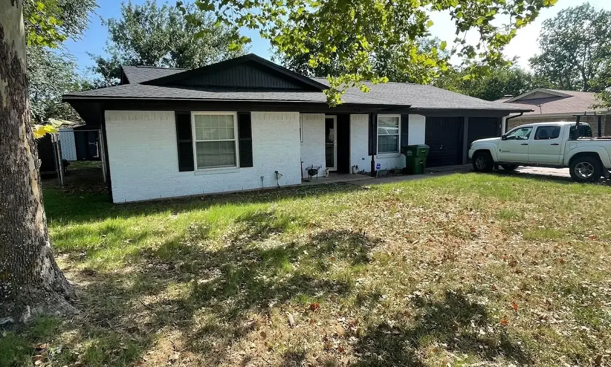 Professional roofing crew working on a residential roof in Parker